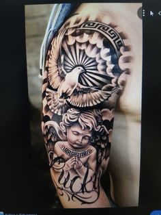 a man's arm with tattoos on it and an eagle in the middle of his arm