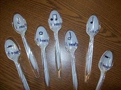 six spoons with the words i love music written on them