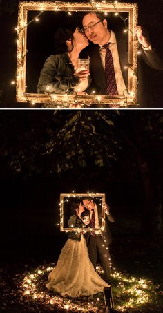 a couple kissing in front of a mirror with fairy lights on it and the reflection of them