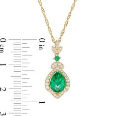 Create a beautiful look with this elegant lotus drop pendant. Fashioned in sterling silver and 14K gold plate, this style showcases an 8.0 x 6.0mm pear-shaped lab-created verdant-green emerald centered in a flower-shaped frame adorned with lab-created shimmering white sapphires. Duos of additional created sapphires grace a leaf trio positioned above a created verdant-green emerald. Buffed to a brilliant luster, this pendant suspends along an 18.0-inch rope chain that secures with a spring-ring clasp. Elegant Drop Jewelry With May Birthstone, Elegant Drop Jewelry For May Birthstone, Elegant Pear-shaped May Birthstone Necklace, Elegant Teardrop Pendant Necklace For May Birthstone, Elegant Teardrop May Birthstone Jewelry, Elegant Pear-shaped Jewelry For May Birthstone, Verdant Green, Crystal Jewelry Sets, Lab Created Emerald