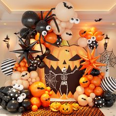 a halloween themed display with balloons and decorations