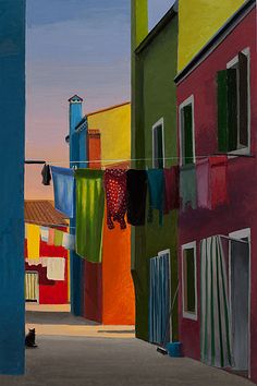 a painting of clothes hanging out to dry in front of buildings and a cat sitting on the ground