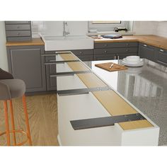 the kitchen counter is made out of white and wood