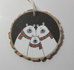 an ornament with two polar bears on it