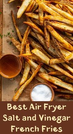 the best air fryer salt and vinegar french fries on a cutting board with dipping sauce