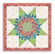 a green and blue star quilt on a white background with an orange, red, and pink border