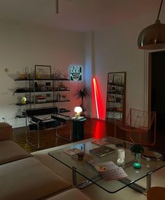 a living room filled with furniture and a red light