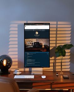 a desktop computer sitting on top of a wooden desk next to a lamp and chair