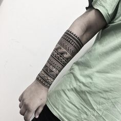 a man's arm with a tattoo on it, and an eye in the middle