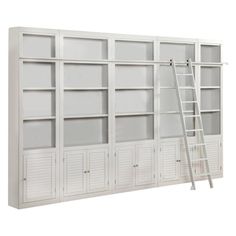 a ladder leaning up against a white bookcase