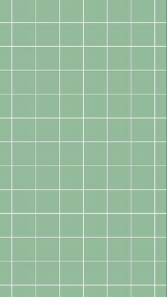 a green tiled wall with small squares