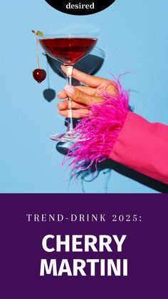 a person holding a wine glass with the words trend - drink 205 cherry martini