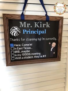 a sign hanging on the side of a building that says mr kirk principals thanks for stopping by i'm currently here