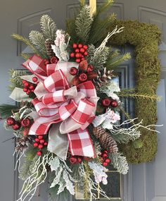 a christmas wreath hanging on the front door