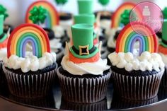 cupcakes decorated with rainbows, hats and shamrocks for st patrick's day