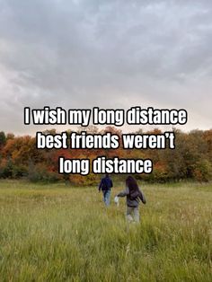 two people walking through a field with the words i wish my long distance best friends weren't long distance