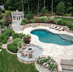 an aerial view of a backyard with a swimming pool