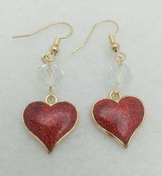 Ruby Clear ER096, Pretty Earrings with Red Glitter Heart Charm and Clear Glass Bead. Perfect as a Valentine or Birthday Gift. Every Woman Deserves to Sparkle! Crystal Dangle Earrings For Valentine's Day, Sparkling Crystal Earrings For Valentine's Day, Valentine's Day Heart Crystal Earrings, Heart-shaped Crystal Earrings For Valentine's Day, Heart-shaped Crystal Rhinestone Earrings For Valentine's Day, Red Heart Earrings, Heart Dangle Earrings, Glitter Hearts, Purse Charms