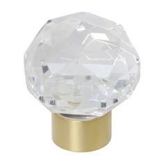 an image of a glass door knob with gold base on a white background for use in home decor