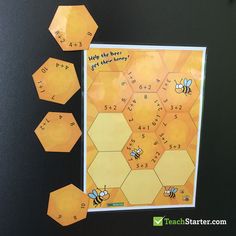 the bees are playing with their numbers on the board