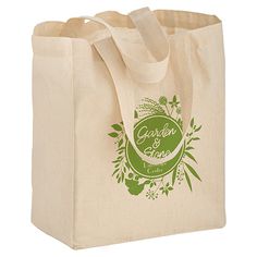 a green and white tote bag sitting on top of a table