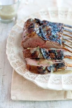 a piece of meat sitting on top of a white plate