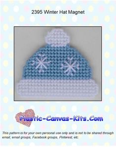 a blue and white knitted hat with two snowflakes on it's top