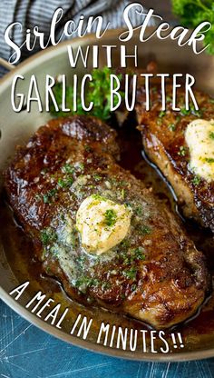 grilled steaks with garlic butter in a skillet