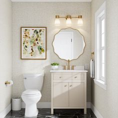 a white toilet sitting next to a bathroom sink under a large mirror on top of a wall