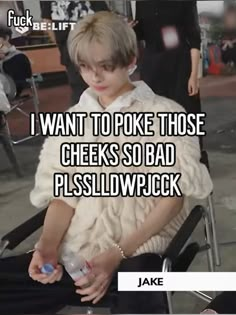 a person sitting in a chair with the caption i want to poke those cheeks so bad