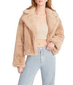 From Steve Madden, this jacket features: Faux fur fabrication Oversized cropped silhouette Notch lapel collar necklineLong sleevesFront side pocketsZip front closure Approx. 16.25" lengthPolyesterDry clean Imported. Chic Cropped Jacket With Faux Fur Trim For Fall, Chic Cropped Winter Outerwear, Trendy Beige Faux Fur Outerwear, Chic Oversized Cropped Outerwear, Oversized Spring Fur Coat With Faux Fur Trim, Oversized Faux Fur Trim Coat For Spring, Oversized Cropped Winter Outerwear, Cropped Winter Outerwear, Cropped Beige Fall Outerwear