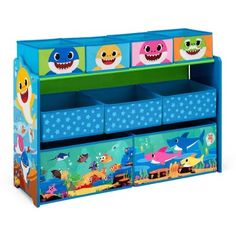 the toy chest has three bins with cartoon animals on it and two shark faces