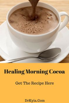 a cup of coffee being poured into it with the words, healing morning cocoa get the recipe here