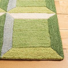 a green and white rug on the floor