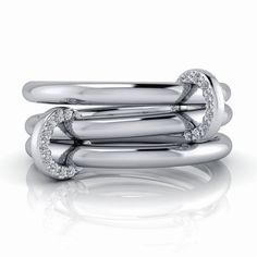 Enhance your style with our Link Stacker No.3. Made with connected rings in silver or... Modern Twist White Gold Jewelry With Ring Detail, Elegant 14k White Gold Stackable Rings, Modern Stackable White Gold Rings, Fine Jewelry Stackable White Gold Rings, Fine Jewelry White Gold Stackable Rings, Elegant Silver Stackable Rings In 14k Gold, Stackable White Gold Fine Jewelry Ring, Elegant Silver-colored 14k Gold Stackable Rings, Modern Stackable Diamond Promise Ring