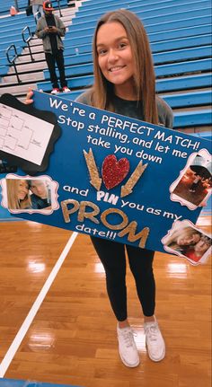 a girl holding up a sign that says, we're a perfect match