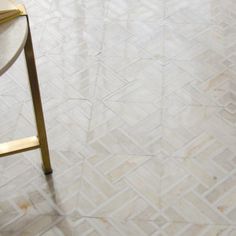 a chair sitting on top of a white tiled floor