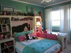 a bed room with a neatly made bed next to a window