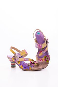 Walk on the wild side with this midnight sol floral leather slingback sandal! Slip into a sassy summer look that's as stylish as it is comfy. It's a no-brainer for any fashionista looking for a chic way to make a statement. Make 'em say "soffia!" 2.16" heel Hook & velcro closure Genuine leather upper Leather footbed Leather lining Leather midsole Rubber sole Summer Vacation Slingback Heels, Summer Leather Heels With Heel Strap, Spring Floral Print Leather Heels, Multicolor Slingback Sandals For Summer, Multicolor Slingback Heels For Summer, Multicolor Slingback Heels For Spring, Multicolor Sandals With Wooden Heel For Spring, Floral Print High Heel Sandals For Summer, Summer High Heel Sandals With Floral Print