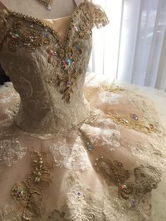 the dress is made up of many different types of beading and sequins