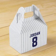 a paper bag with the number 8 on it sitting on top of a wooden table