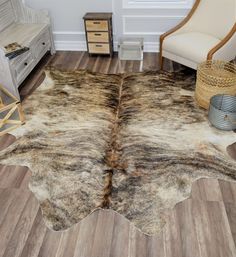 a cowhide rug is shown on the floor