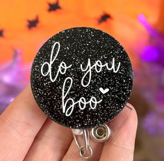 Our Do you boo badge reel would make a perfect gift for nursing, coworkers, hospital staff, doctors, students, teachers, child care providers, office workers, and anyone who adorns keys, identification, or swipe cards. Or treat yourself!  The Halloween design is created from smooth yet sturdy acrylic. The dog is attached to a round retractable reel which is extendable to 34" for ease of card swiping, and snapping back into place immediately upon releasing your card. The reel itself is attached to a either a standard clothing clip (which you can clamp on your scrubs, collar, belt, or just about any other material), or a slide on pocket/belt clip, which are both available in the options section of this listing. We love custom orders and if you have a specific variation or design in mind, the Black Badge Reel, Halloween Gift, Black Badge Reel For Halloween Gift, Black Halloween Badge Reel Gift, Halloween Gift Black Badge Reel, Personalized Black Badge Reel For Personal Use, Novelty Black Badge Reel For Gift, Novelty Black Badge Reel Customizable, Customizable Novelty Black Badge Reel, Customizable Black Novelty Badge Reel