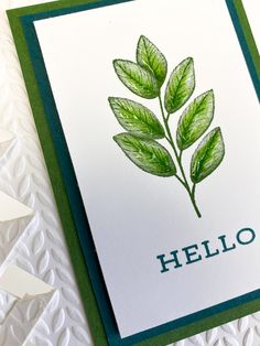 a close up of a card with leaves on it