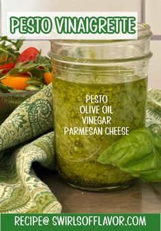 pesto vinagrete in a jar with basil leaves