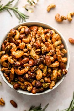 a bowl filled with nuts on top of a table