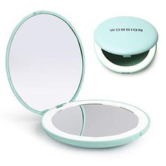 a compact mirror with the lid open to show it's reflection in its case