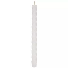 a tall white candle on a white background