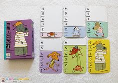 four matching cards with pictures of dogs and numbers