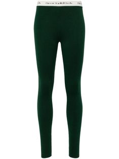 dark green stretch-design logo waistband skinny cut slip-on style straight hem Green Comfort Stretch Pants, Green Comfort Stretch Elastane Bottoms, Green Comfort Stretch Bottoms, Green Elastic Sporty Bottoms, Stretch Green Leggings With Elastic Waistband, Green Stretch Leggings With Elastic Waistband, Sporty Tight Green Pants, Green Bottoms With Ribbed Waistband For Fall, Green Elastane Leggings